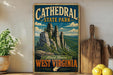 A vintage-style sign for Cathedral State Park in West Virginia, featuring a scenic illustration of the park's rock formations and mountains.