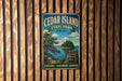 A vintage metal sign for Cedar Island State Park in New York, featuring a scenic landscape with a lake, pine trees, and a waterfall.