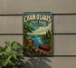 A vintage-style metal sign for Chain O'Lakes State Park in Illinois, featuring a scenic image of a lake, canoe, and forest.