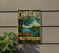 A vintage-style metal sign for Chain of Lakes State Park in Indiana, featuring a canoe on a lake and a scenic landscape.