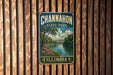 A vintage metal sign for Channahon State Park in Illinois, featuring a scenic landscape with a river, bridge, and trees.