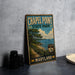 A vintage metal sign for Chapel Point State Park in Maryland, featuring a scenic landscape with a beach, trees, and a body of water.