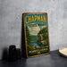 A vintage metal sign for Chapman State Park in Pennsylvania, featuring a scenic landscape with a river and forest.