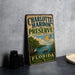 A vintage-style metal sign for Charlotte Harbor Preserve, Florida, featuring a scenic illustration of the preserve and its surrounding natural beauty.