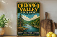 A vintage-style sign for Chenango Valley State Park in New York, featuring a scenic illustration of a river and mountains.