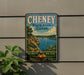 A vintage-style metal sign for Cheney State Park in Kansas, featuring a scenic landscape with a lake, mountains, and a sailboat.