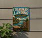 A vintage-style sign for the state park called "Cherokee Landing" in Oklahoma, featuring a scenic image of the park and its surrounding nature.
