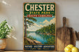 A vintage-style sign for Chester State Park in South Carolina, featuring a scenic image of a lake surrounded by trees and mountains.