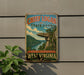 A vintage-style metal sign for Chief Logan State Park, featuring a scenic landscape with a cliff and river.