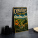A vintage-style metal sign for Chinook Hills State Park, featuring a scenic landscape with mountains, flowers, and a winding path.