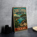 A vintage-style sign for Choke Canyon State Park in Texas, featuring a scenic landscape with a lake, mountains, and cacti.