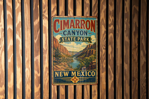 A vintage metal sign for Cimarron Canyon State Park in New Mexico, featuring a scenic illustration of the canyon landscape.