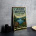A vintage-style metal sign for Clarence Fahnestock State Park in New York, featuring a scenic landscape with a lake, mountains, and an eagle.