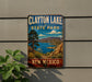 A vintage-style sign for Clayton Lake State Park in New Mexico, featuring a scenic landscape with mountains, a lake, and desert vegetation.