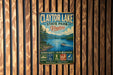 A vintage metal sign for Clayton Lake State Park, Virginia, featuring a scenic image of the lake and mountains.
