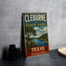 A vintage-style metal sign for Cleburne State Park, featuring a scenic landscape with a river and trees, is displayed on a gray countertop.