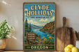 A vintage-style sign for Clyde Holiday State Recreation Site in Oregon, featuring a scenic landscape with a river, mountains, and flowers.