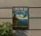 A vintage-style metal sign for Cobscook Bay State Park in Maine, featuring a scenic landscape with a pine tree, a bird in flight, and a body of water.