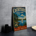 A vintage metal sign for Cochitiate State Park, featuring a scenic illustration of a lake with a sailboat, surrounded by pine trees and mountains.