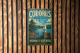 A vintage metal sign for Codorus State Park in Pennsylvania, featuring a scenic illustration of a lake, pine trees, and a sailboat.