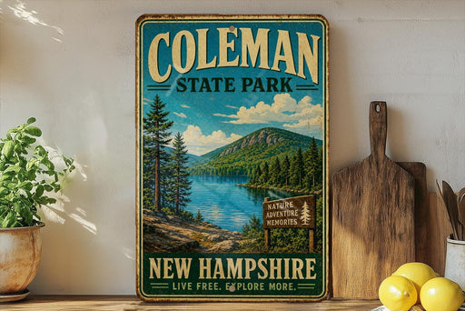A vintage-style sign for Coleman State Park in New Hampshire, featuring a scenic landscape with pine trees, a lake, and mountains.