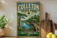 A vintage-style sign for Colleton State Park in South Carolina, featuring a scenic illustration of a river, bridge, and surrounding landscape.