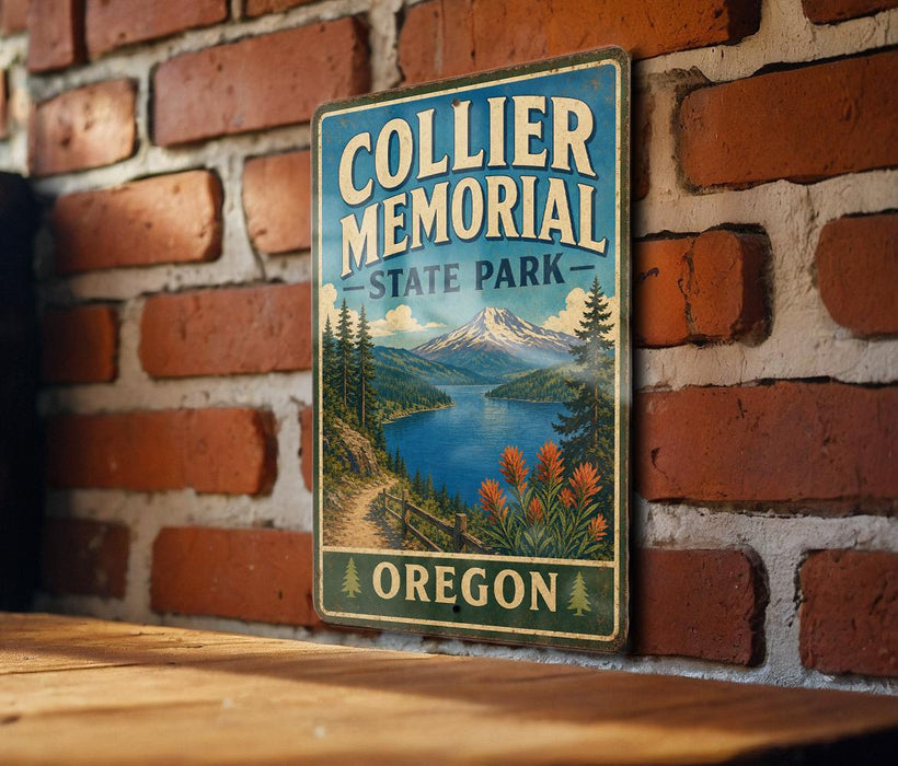 A vintage metal sign for Collier Memorial State Park in Oregon, featuring a scenic landscape with mountains, a lake, and pine trees.