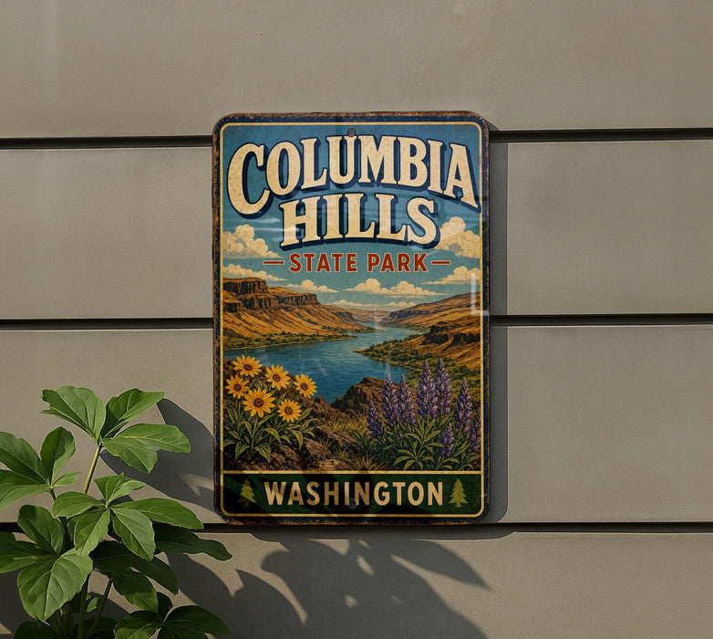 A vintage-style metal sign for Columbia Hills State Park in Washington, featuring a scenic landscape with mountains, a river, and sunflowers.
