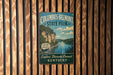 A vintage-style metal sign for Columbus-Belmont State Park in Kentucky, featuring a scenic image of a river and cliffs.
