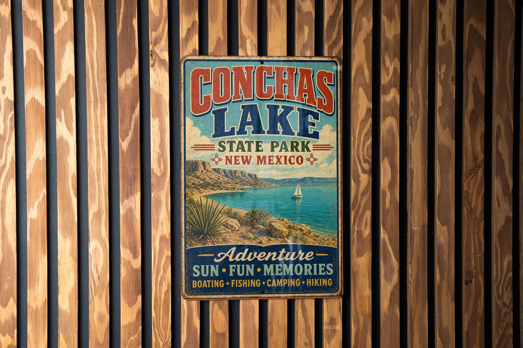 A vintage metal sign for Conchas Lake State Park in New Mexico, featuring a scenic image of the lake and mountains.
