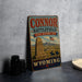 a vintage-style sign for the "Connor Battlefield State Historic Site" in Wyoming, with a cowboy on horseback and a monument in the background.
