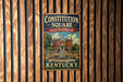 A vintage-style metal sign for the Constitution Square State Historic Site in Danville, Kentucky, featuring an illustration of a historic building surrounded by trees.