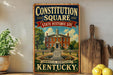 a vintage-style metal sign with a picture of a historic building, surrounded by a garden, and the text "Constitution Square State Historic Site" and "DANVILLE, KENTUCKY".