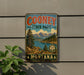 A vintage-style metal sign for Cooney State Park in Montana, featuring a scenic landscape with mountains, trees, and a lake.