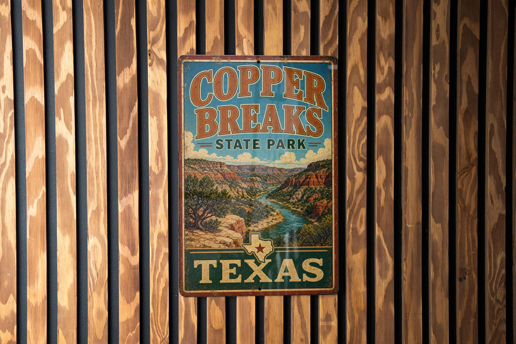 A vintage-style metal sign for Copper Breaks State Park in Texas, featuring a scenic landscape with a river and mountains.