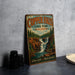 A vintage-style metal sign for Copper Falls State Park in Wisconsin, featuring a scenic illustration of a waterfall surrounded by pine trees.