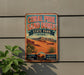 A vintage-style metal sign for Coral Pink Sand Dunes State Park in Utah, featuring a desert landscape with mountains in the background.
