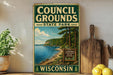 A vintage-style sign for Council Grounds State Park in Wisconsin, featuring a scenic image of a lake and forest.