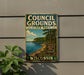 A vintage-style metal sign for Council Grounds State Park in Wisconsin, featuring a scenic landscape with a lake and forest.