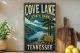 A vintage-style sign for Cove Lake State Park in Tennessee, featuring a scenic illustration of the lake surrounded by mountains and pine trees.