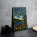 A vintage metal sign for Craig Lake State Park in Michigan, featuring a scenic illustration of a lake, canoe, and pine trees.