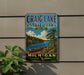 A vintage metal sign for Craig Lake State Park, featuring a scenic image of a canoe on a lake surrounded by pine trees and mountains.