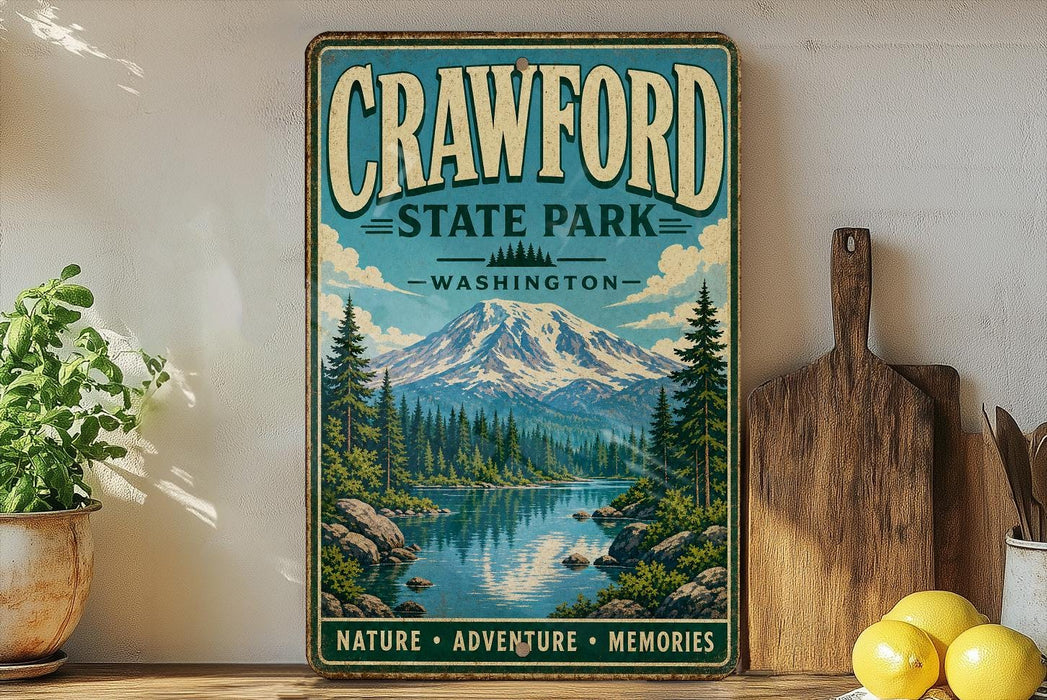 A vintage-style sign for Crawford State Park in Washington, featuring a scenic mountain landscape with pine trees and a lake.