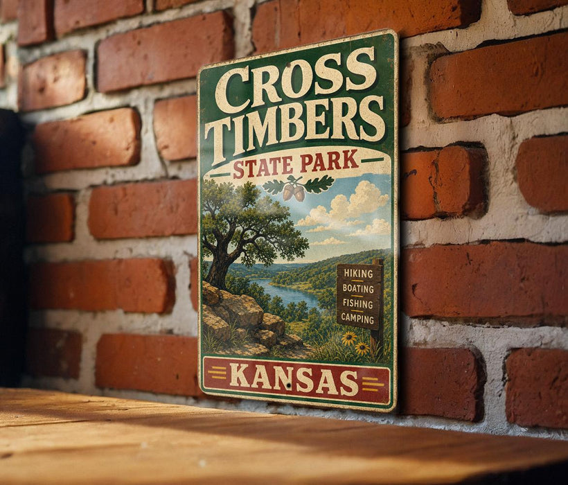 A vintage-style metal sign for Cross Timbers State Park in Kansas, featuring a scenic landscape with a river, trees, and mountains.