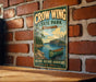 A vintage metal sign for Crow Wing State Park in Minnesota, featuring a canoe and a scenic landscape.