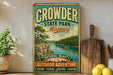 A vintage-style metal sign for Crowder State Park in Missouri, featuring a scenic landscape with a river and mountains.