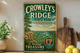 A vintage-style sign for Crowley's Ridge State Park in Arkansas, featuring a scenic landscape with a winding river and lush greenery.