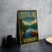 A vintage-style sign for Crystal Lake State Park in Vermont, featuring a scenic image of a lake and mountains.