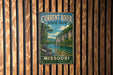 A vintage metal sign for Current River State Park in Missouri, featuring a scenic illustration of a river surrounded by lush greenery.