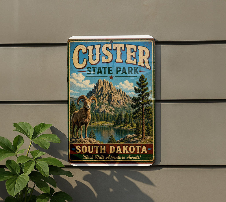 A vintage-style sign for Custer State Park, featuring a mountain landscape with a bighorn sheep in the foreground.